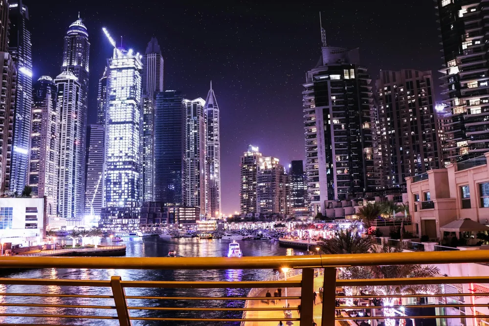 How can expats buy their own property in Dubai?